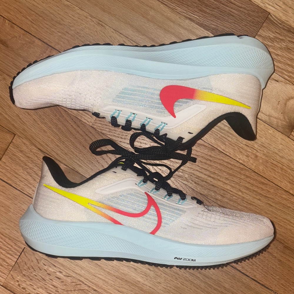 Nike Women’s Light Blue Running Shoes with Pink & Yellow Swoosh Accents